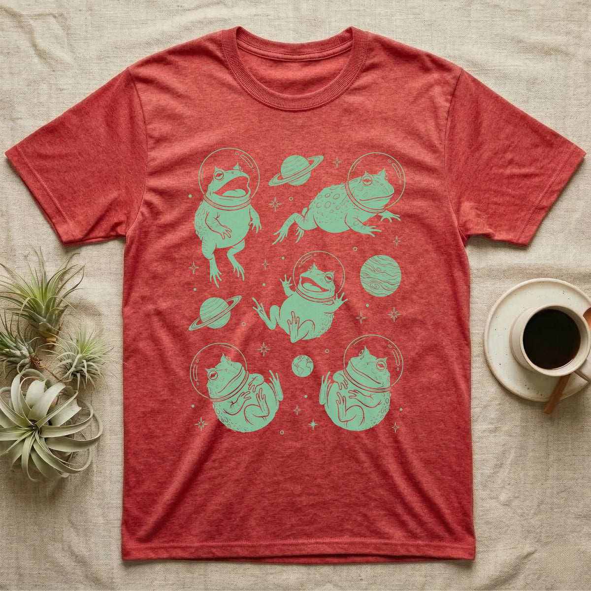 Pacman Frog Cosmic T-Shirt in Heather Red — Vintage screen-print illustration of Pacman frogs in astronaut helmets floating in space, cosmic jade green monochromatic on dark background.