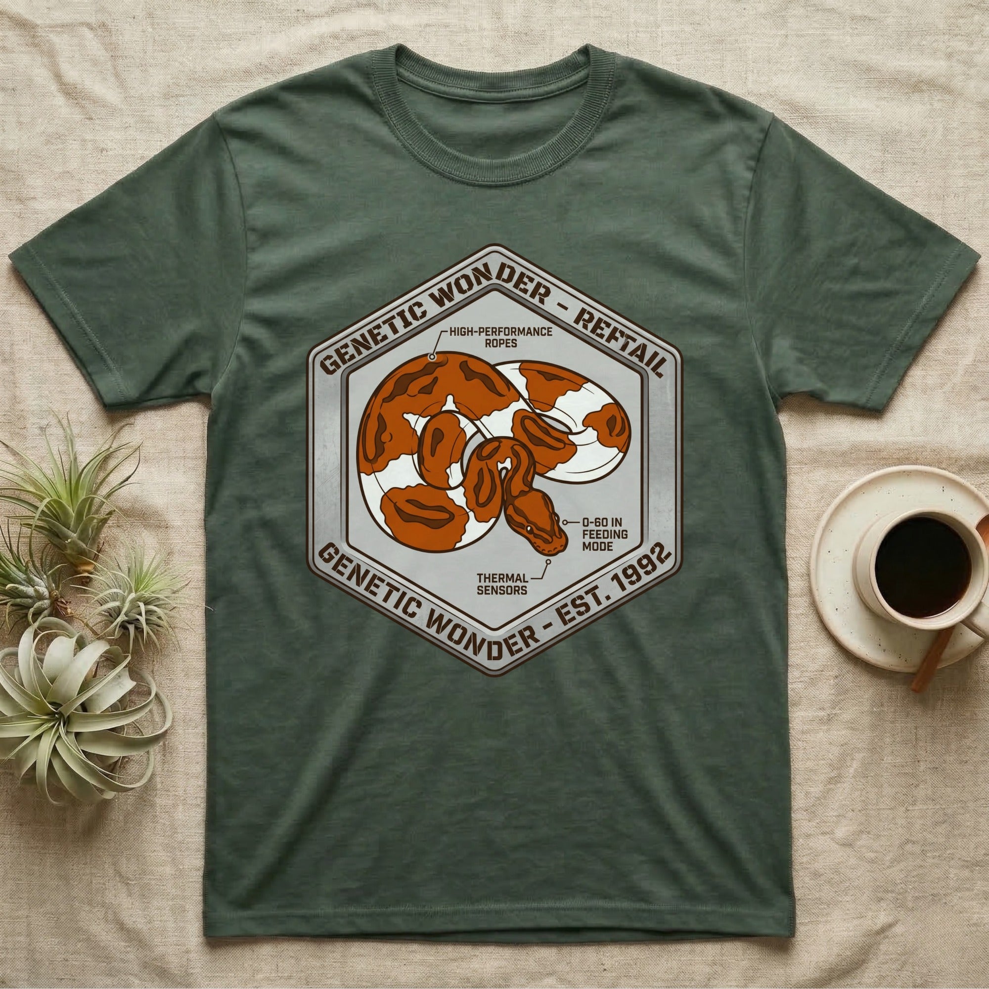 Green t-shirt with hexagonal logo featuring snake pattern and text "Genetic Wonder - Rerail".