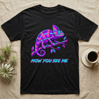 Black t-shirt with a neon purple and blue chameleon on a branch, reading "Now You See Me".