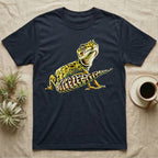Illustration of a smiling leopard gecko with a plump curled spotted tail, bold vintage-comic ink outlines and halftone shading, graphic-only, no text. — shown on a Navy tee.