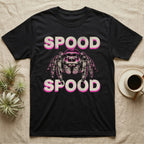 Spood Jumping Spider T-Shirt in Black — Grunge-punk illustration of an oversized front-facing jumping spider with a distressed "Spood" wordmark in bone and acid pink.