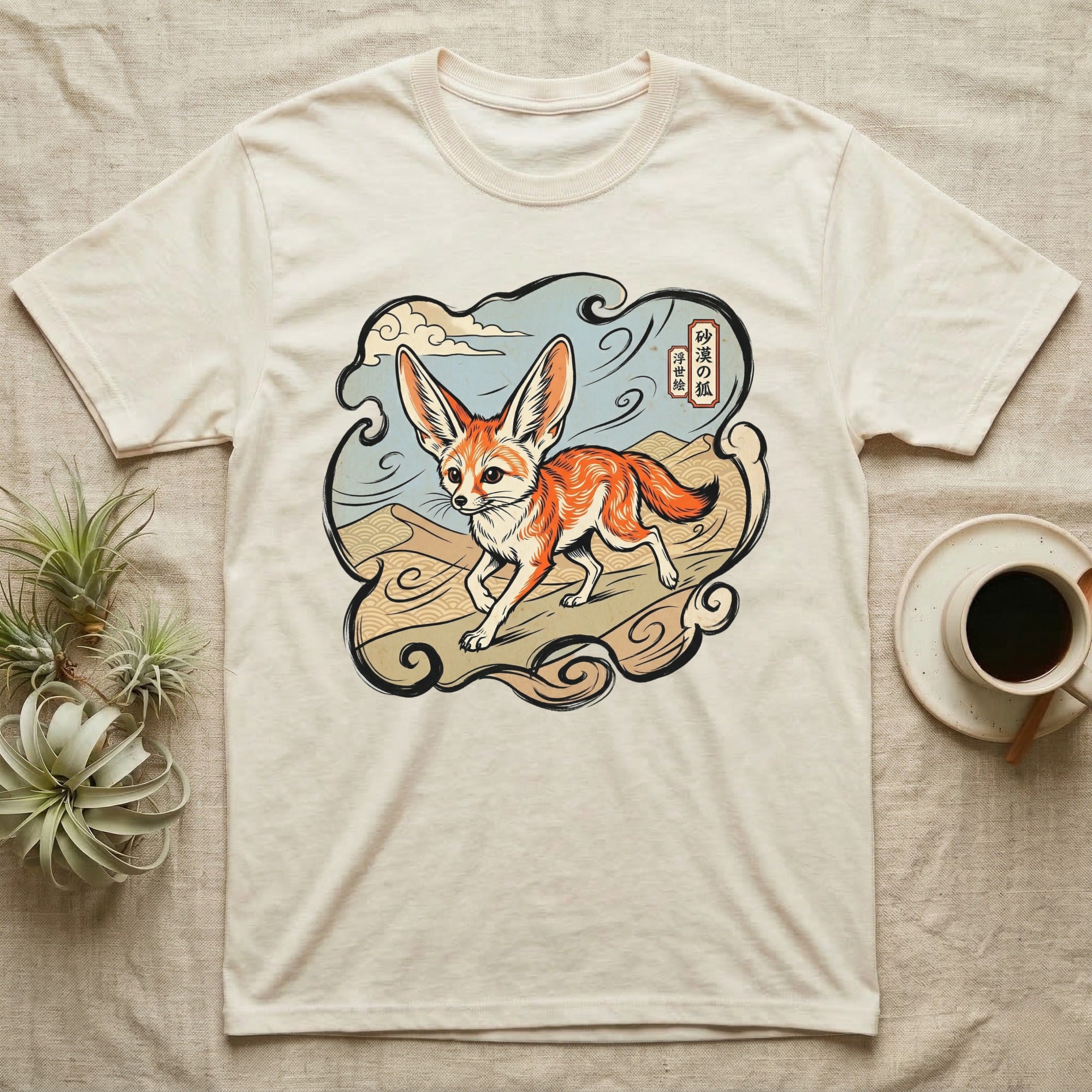 Fennec fox illustration on a cream t-shirt with Japanese text.