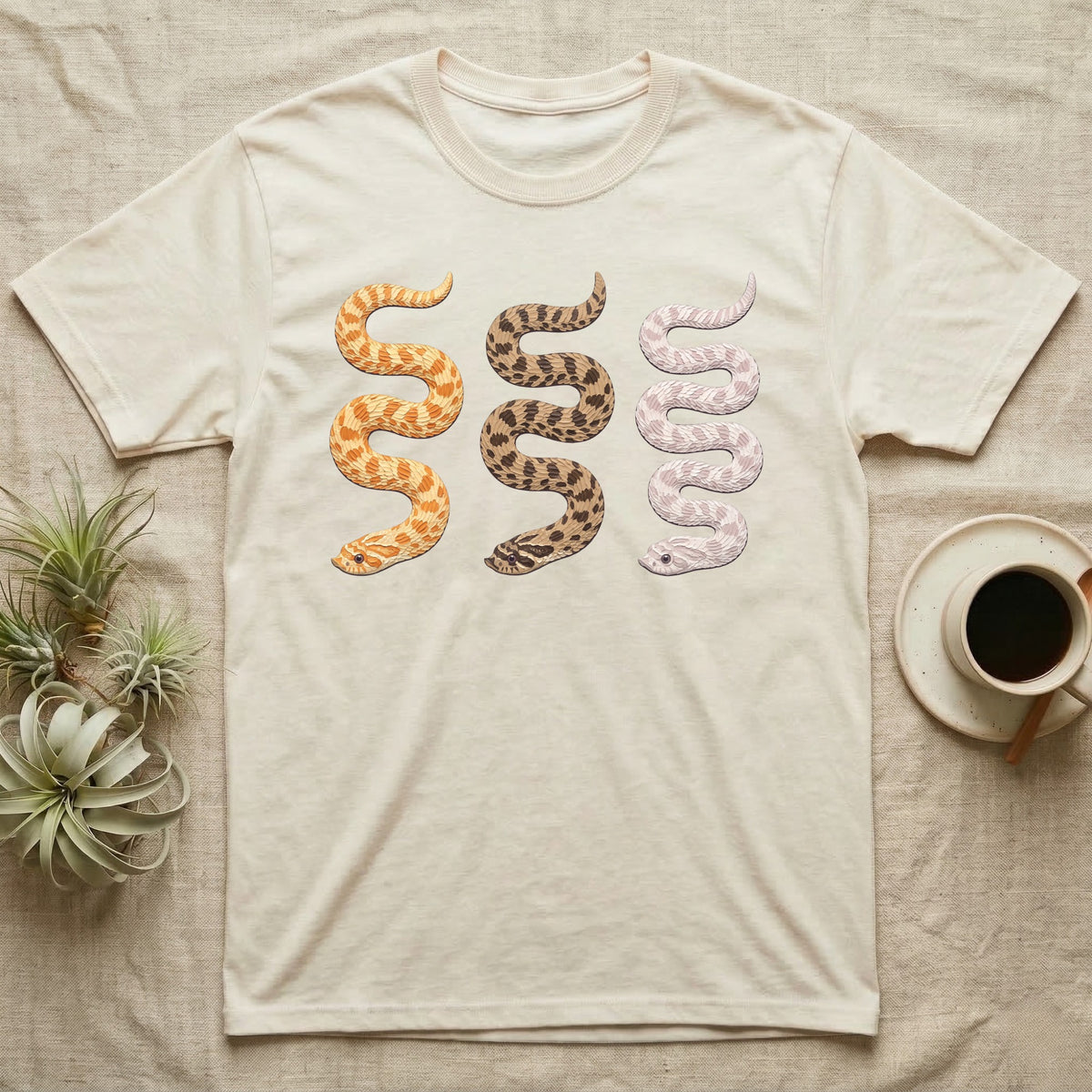 Hognose Morph Triptych T-Shirt in Natural — Palette-knife painting of three western hognose snakes side by side, albino, anaconda and snow morphs.