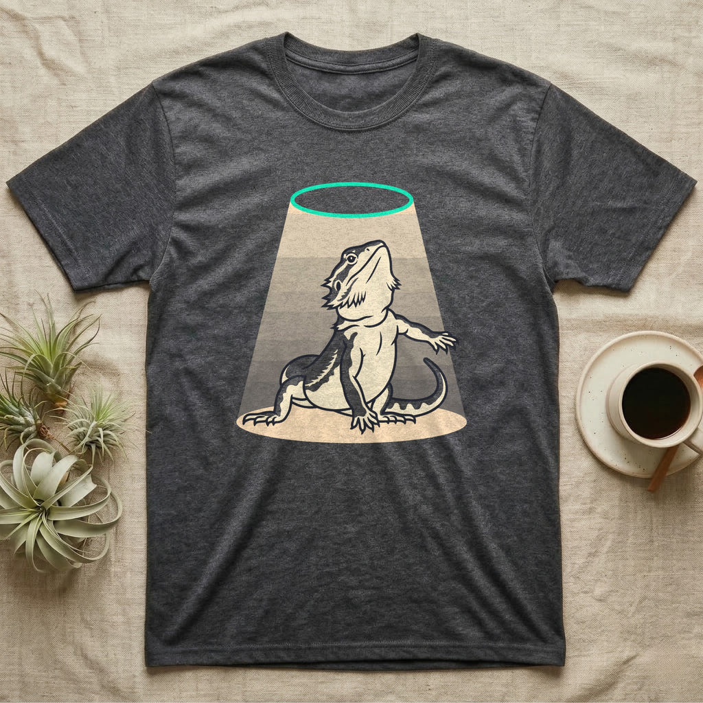 Bearded Dragon Diva T-Shirt in Dark Heather — Bold vector illustration of a bearded dragon in a dramatic stage pose under a soft spotlight, chin lifted.