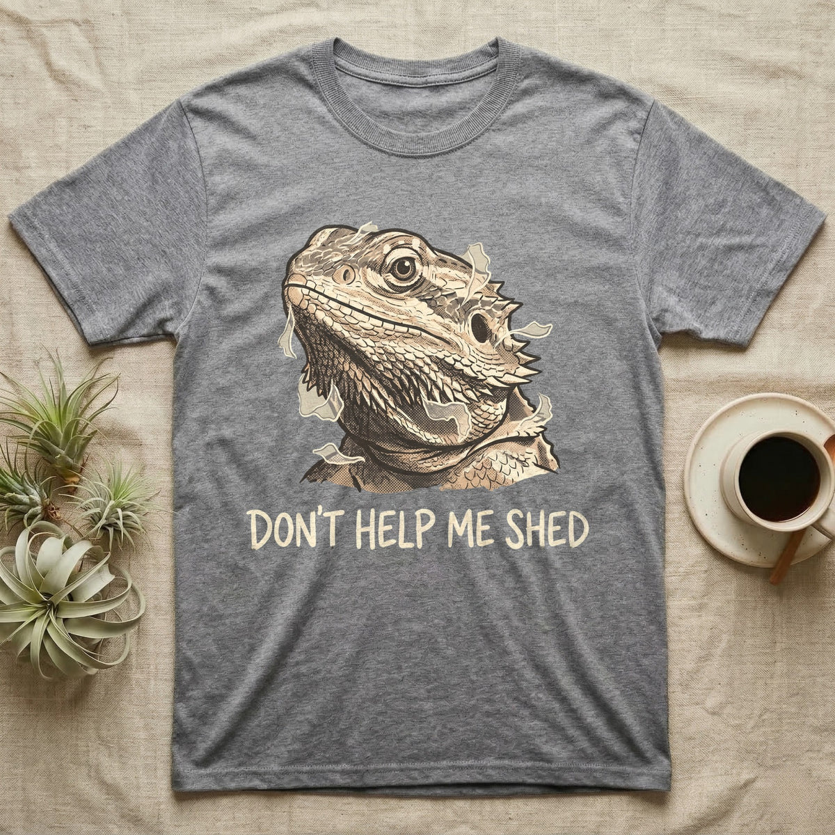 Don't Help Me Shed T-Shirt in Sport Grey — Retro-illustration of a bearded dragon mid-shed with a deadpan side-eye and a marker caption reading Don't Help Me Shed.