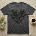 Dark grey t-shirt with a heart-shaped design of a scorpion, rocks, and ferns.