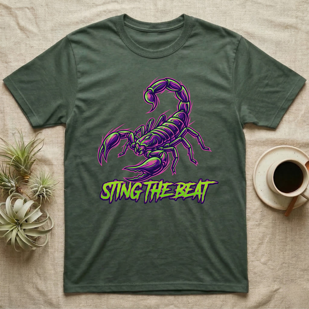 Dark green t-shirt with neon purple scorpion graphic and text "STING THE BEAT".