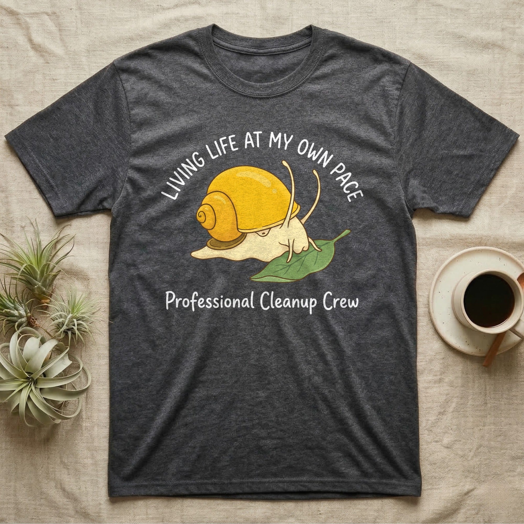 Dark gray t-shirt with a cartoon snail and "Professional Cleanup Crew" text.