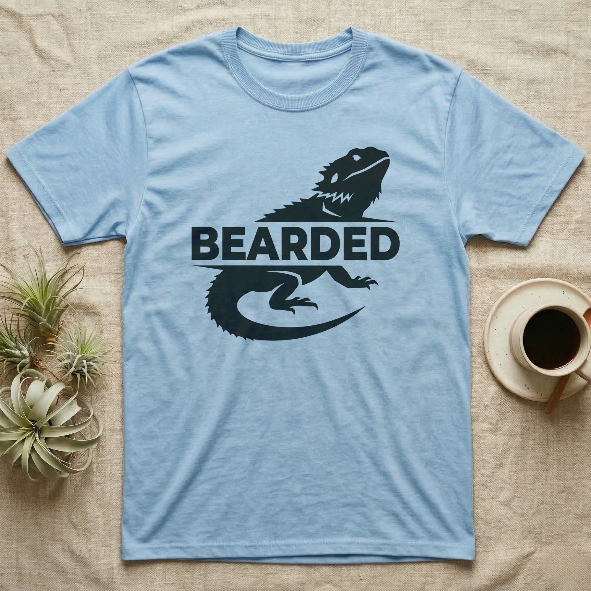 Light blue t-shirt with a black lizard silhouette and "BEARDED" text.