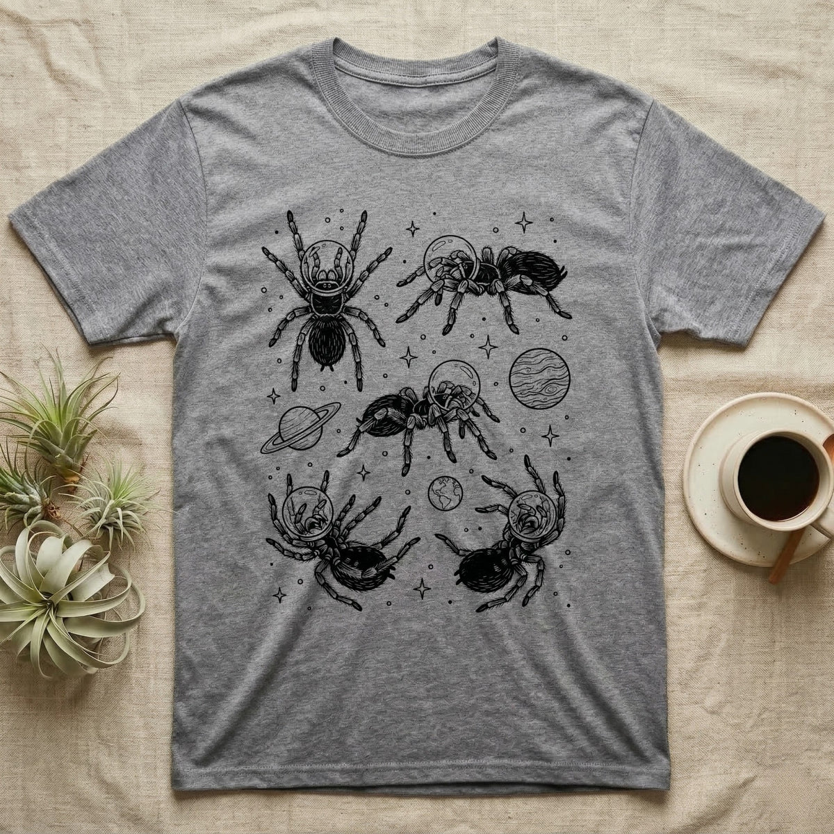 Tarantula Cosmic T-Shirt in Sport Grey — Vintage screen-print illustration of tarantulas in astronaut helmets floating in space, obsidian black monochromatic on dark grey background.