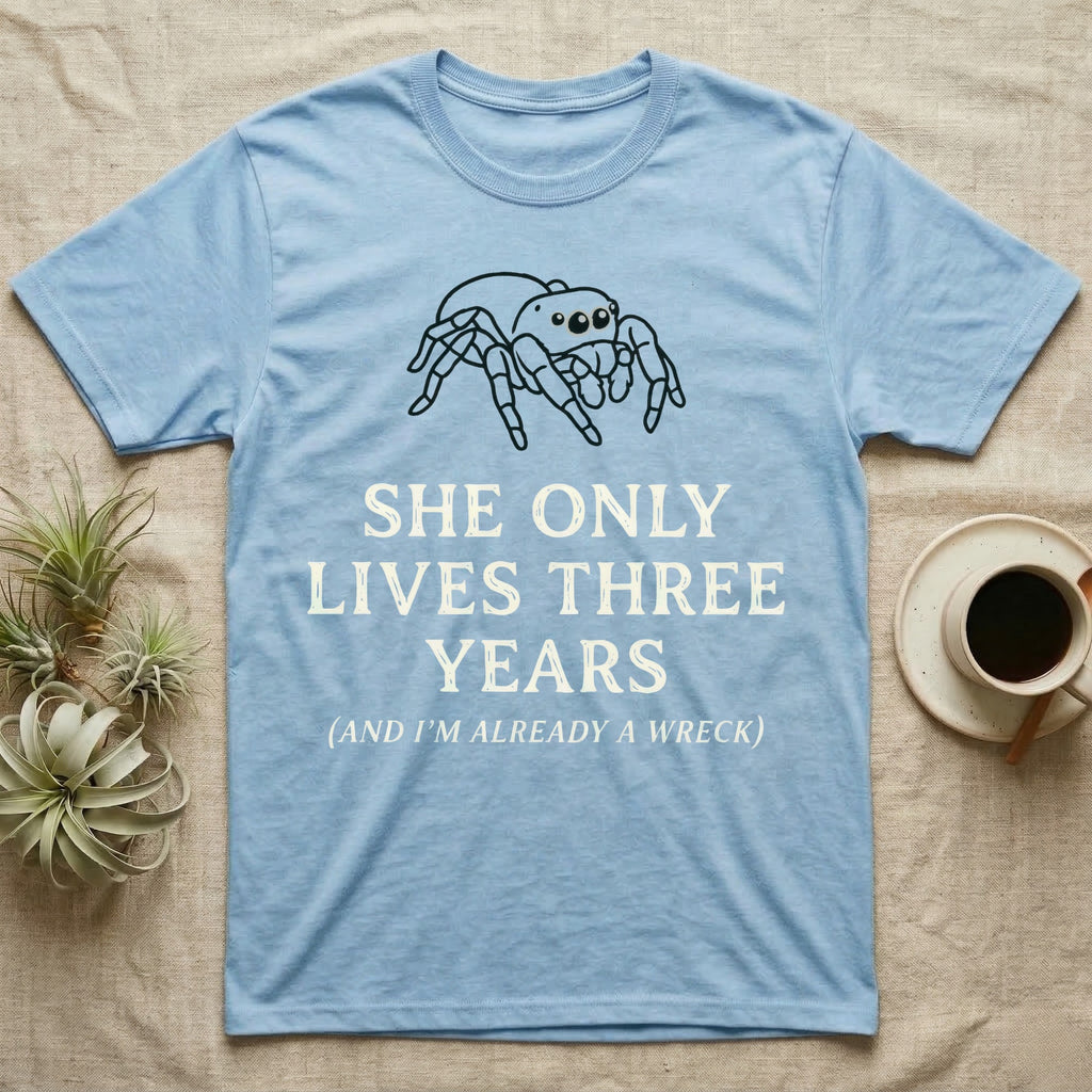 Jumping Spider Three Years Tee in Light Blue — Vintage-ink Phidippus jumping spider portrait above type "She Only Lives Three Years (And I'm Already A Wreck)."
