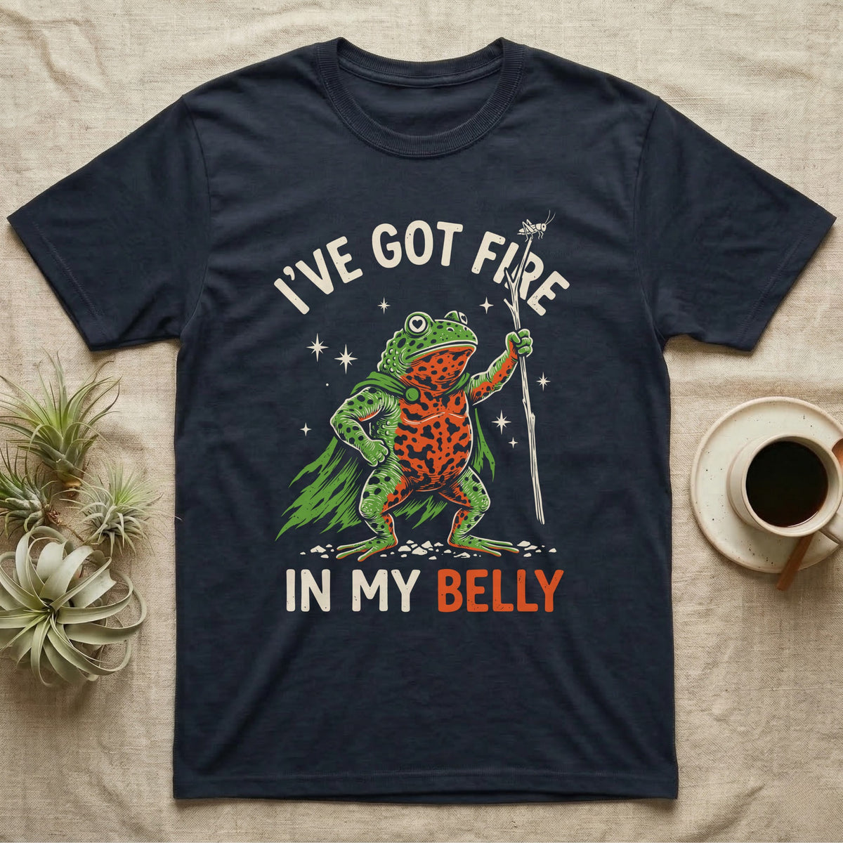 Fire-Bellied Toad Knight T-Shirt in Navy — Fire-bellied toad knight with green cape, orange belly and a cricket on a twig spear, lettered I'VE GOT FIRE IN MY BELLY