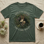 Crested Gecko Care Sheet T-Shirt in Military Green — Botanical wreath of pothos and moss circling a crested gecko, closed by two arcs of Roman capitals.