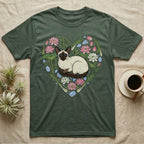 Green t-shirt with Siamese cat illustration surrounded by lotus flowers and water plants.