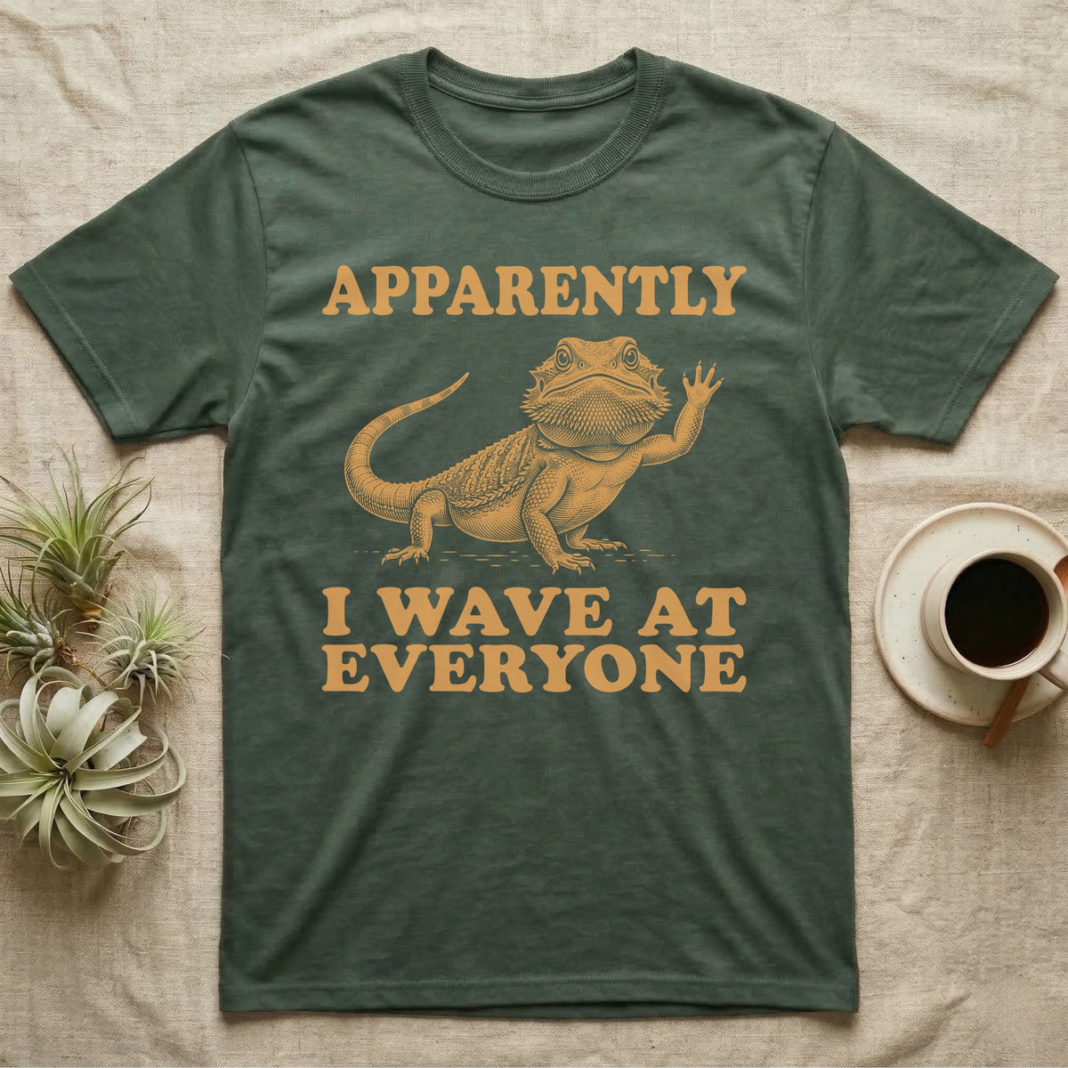 Bearded Dragon Engraving T-Shirt in Military Green — Antique green engraving of a bearded dragon raising one arm between the words APPARENTLY and I WAVE AT EVERYONE