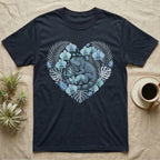 Dark t-shirt with a gray iguana and blue flowers inside a heart-shaped floral design.