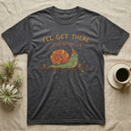 Dark gray t-shirt with cartoon snail on a branch saying "I'll get there eventually."