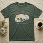 Green t-shirt with "BAD SKIN DAY" and a shedding lizard graphic.