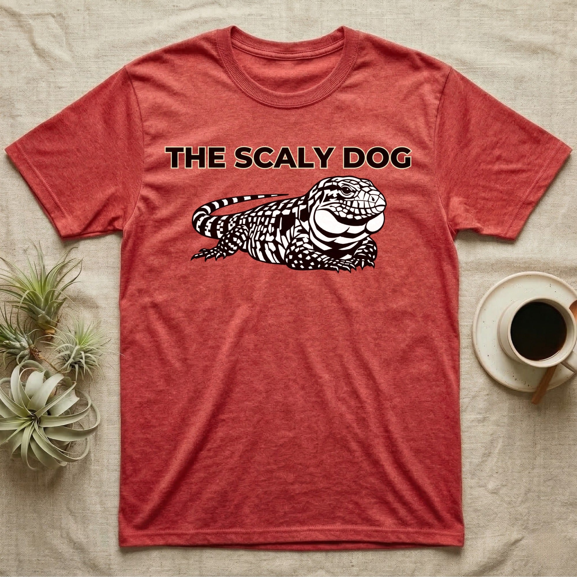 Red t-shirt with "THE SCALY DOG" and a lizard illustration.