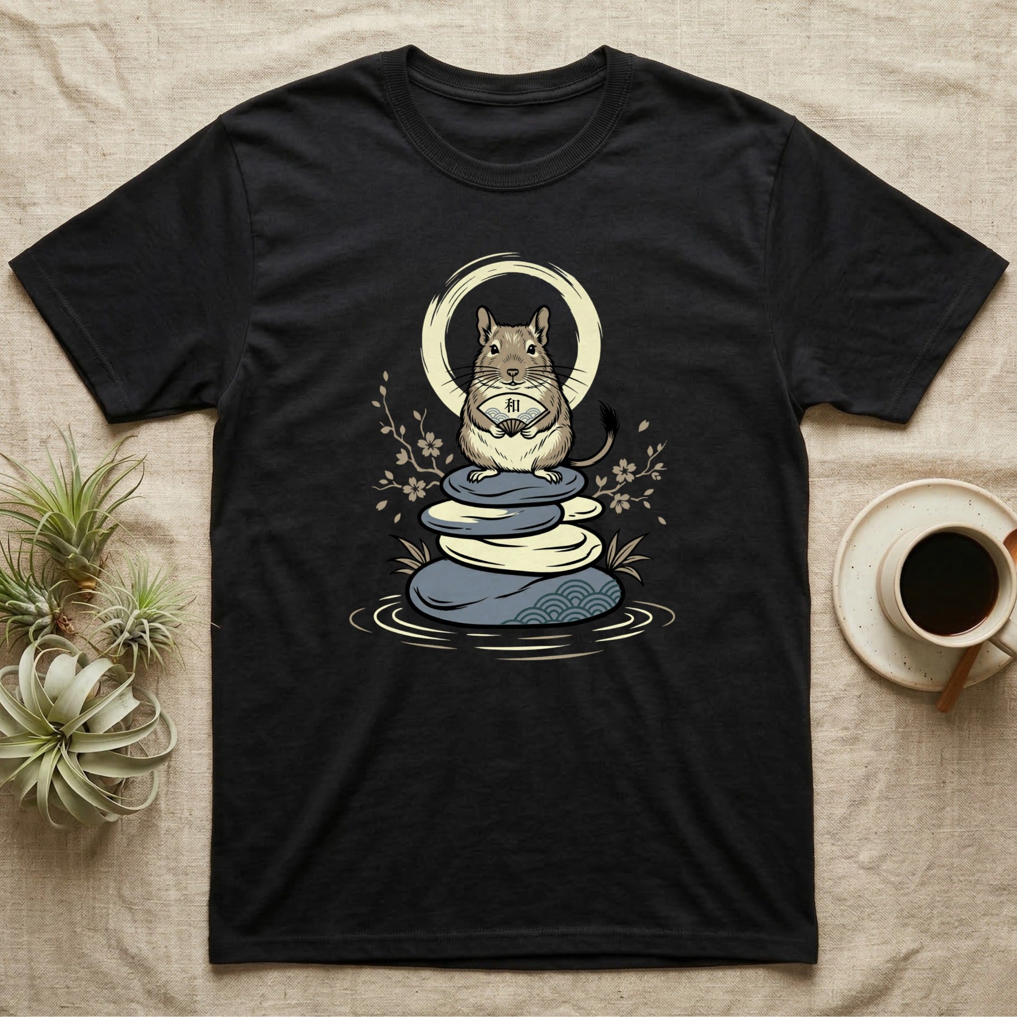 Black t-shirt featuring a stylized degu holding a Japanese character on stacked zen stones.