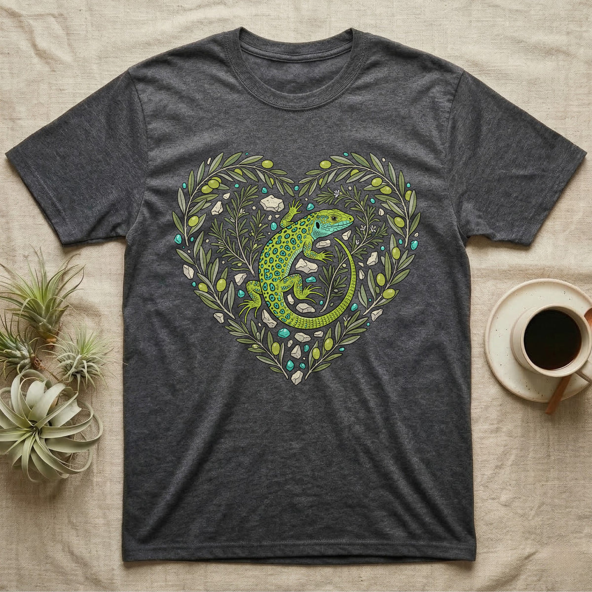 Dark grey t-shirt with a green lizard and floral heart design.