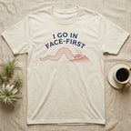 Western Hognose Face-First T-Shirt in Natural — Two-ink worn-stamp print of a western hognose snake digging head-first into a mound of sand beneath arched text reading I GO IN FACE-FIRST.