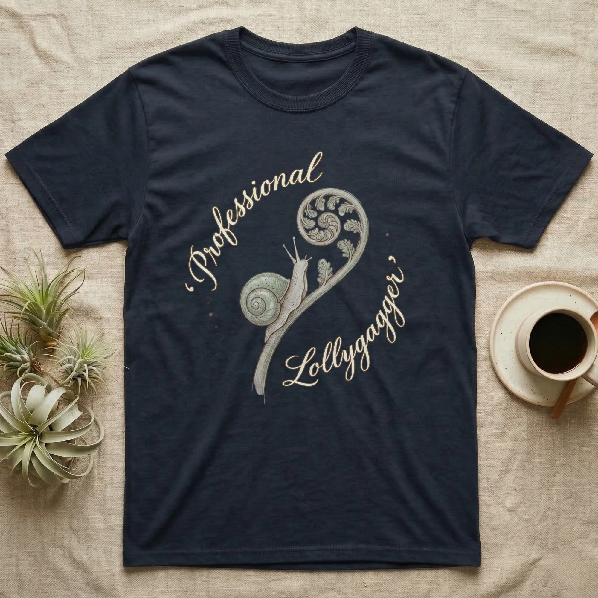 Navy t-shirt with a fern and snail graphic and "Professional Lollygagger" text.