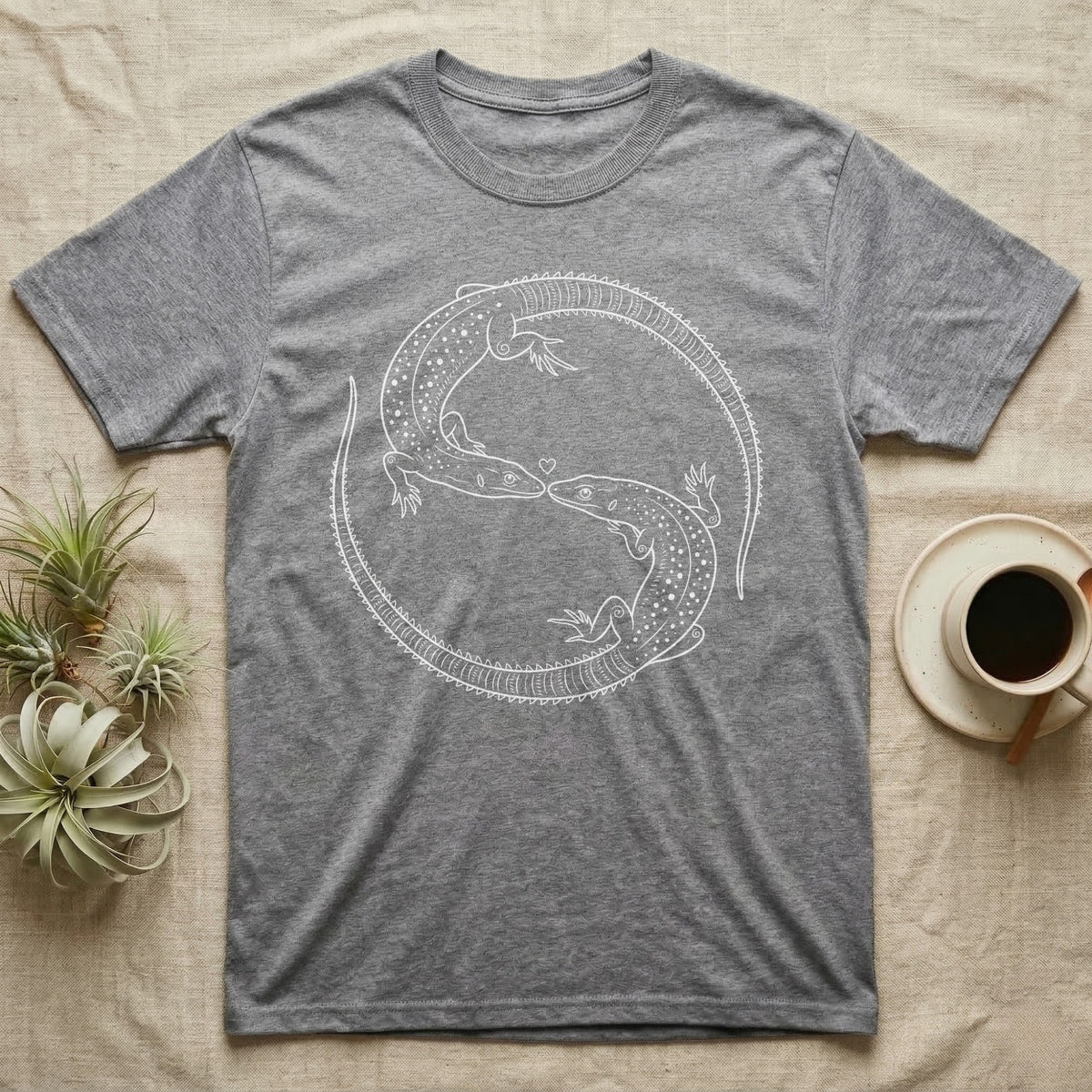 Ackie Monitor Roundel T-Shirt in Sport Grey — Two ackie monitors in fine white line art, mirrored at 180 degrees around a tiny heart, tails sweeping outward.