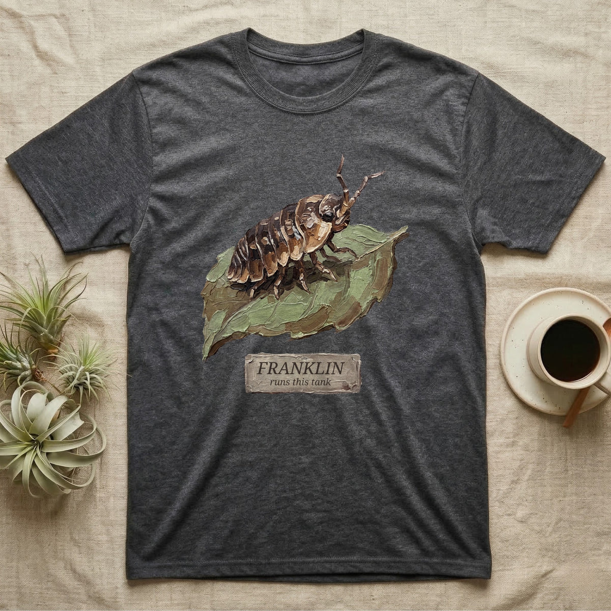 Franklin Isopod Tank T-Shirt in Dark Heather — Impasto oil-painting portrait of an isopod on a leaf with an engraved Franklin name-plate beneath the subject.