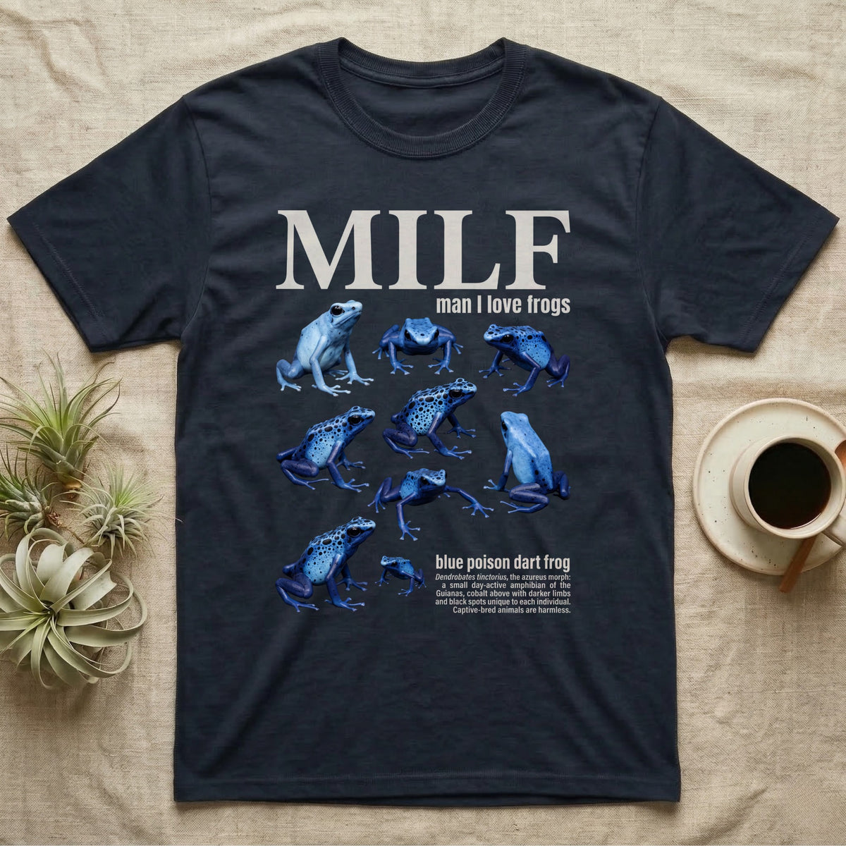 Blue Poison Dart Frog T-Shirt in Navy — Eight blue poison dart frogs in a cut-out photo collage beneath the huge cream word MILF on grey.