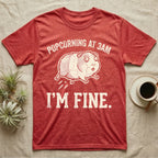 Guinea Pig Popcorning 3AM Tee in Heather Red — Grunge-distressed guinea pig mid-popcorn with all four feet airborne and distressed type "Popcorning At 3AM I'm Fine."