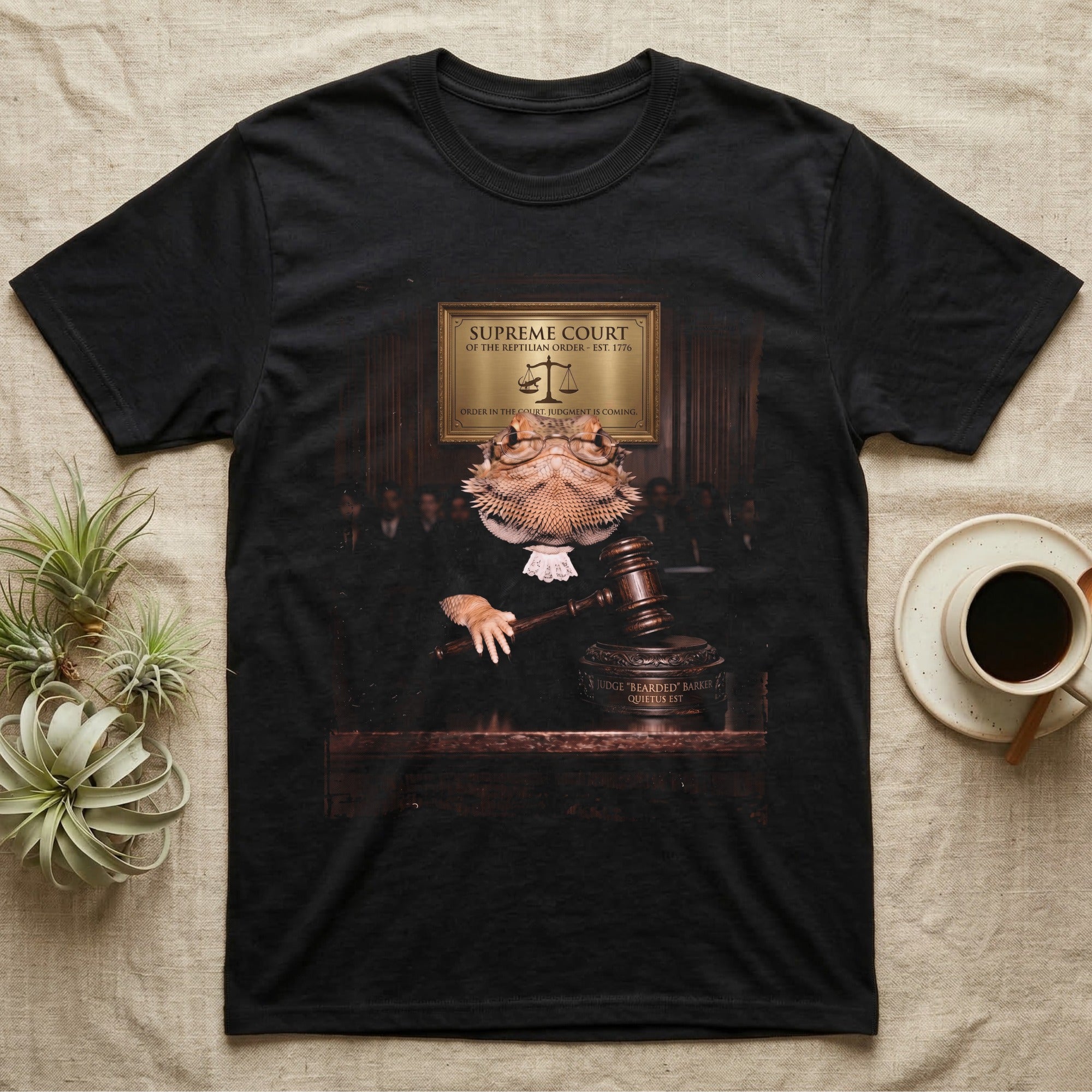 Bearded Dragon Judge T-Shirt in Black — Bearded dragon in a judge's robe and spectacles resting a hand on a gavel under a Supreme Court of the Reptilian Order plaque.