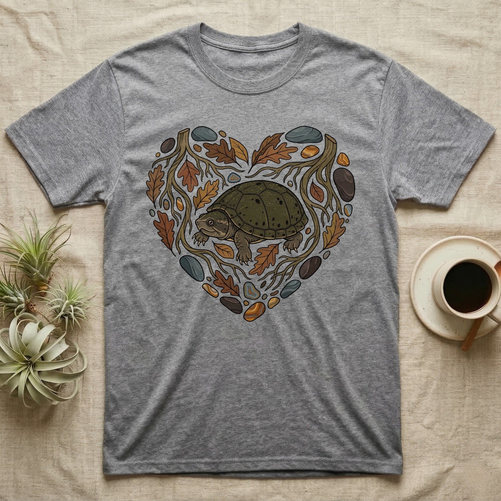 Grey t-shirt with a heart-shaped natural design featuring a turtle and leaves.