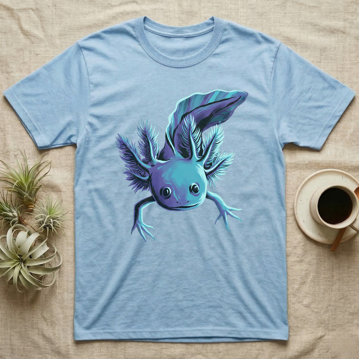 Neon cyan and purple illustration of a floating axolotl with spread gill plumes in a glowing bioluminescent style, no on-shirt text. — shown on a Light Blue tee.