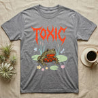 Oriental Fire-Bellied Toad Feral T-Shirt in Sport Grey — Pastel fire-bellied toad with red-orange belly among lily pads and dragonflies, jagged metal wordmark "TOXIC" above.