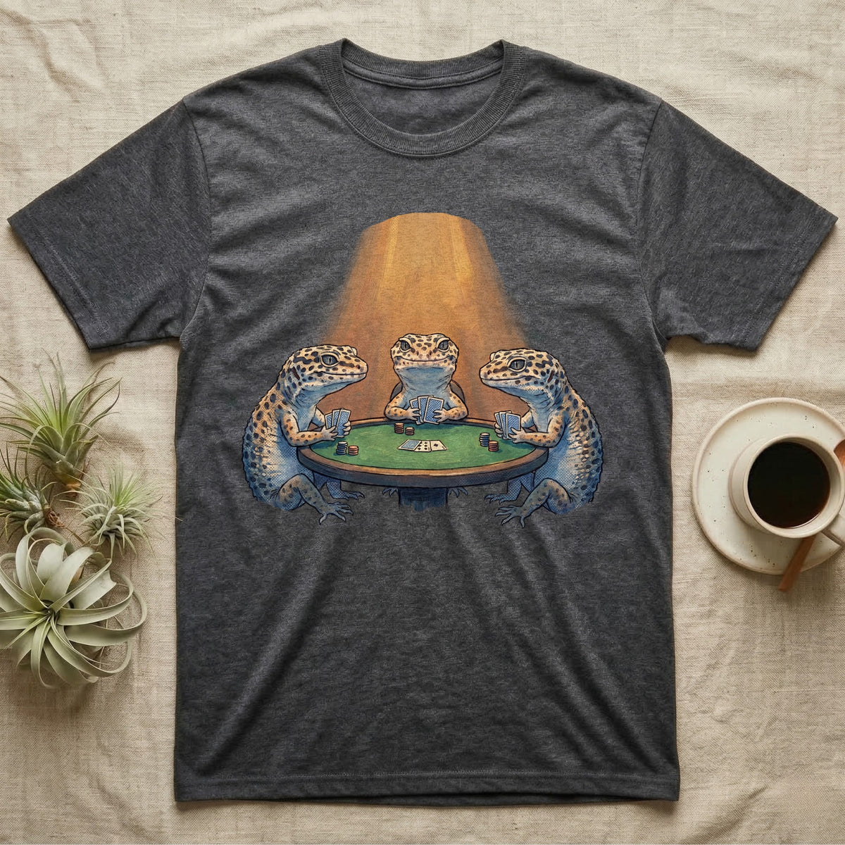Leopard Gecko Poker T-Shirt in Dark Heather — Vintage oil-painting tableau of three leopard geckos playing poker around a green-felt table in warm amber light.
