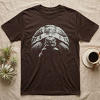 Hermann's Tortoise Tough T-Shirt in Dark Chocolate — Black-and-white photo of a Hermann's tortoise staring ahead, a dandelion stem hanging from its beak like a cigarette