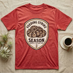 Ball Python Feeding Strike T-Shirt in Heather Red — Vintage-ink badge of a coiled ball python with carved type "Feeding Strike Season" and fine print "Months 3-7 Of Every Year."
