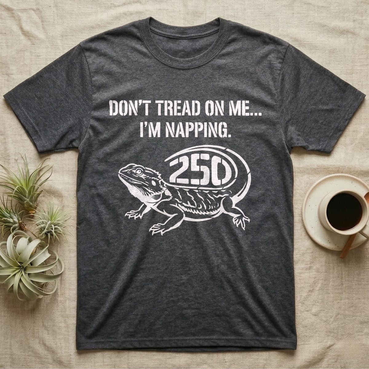 Bearded Dragon Napping T-Shirt in Dark Heather — White stencil bearded dragon resting with 250 cut into the tail under text Don't Tread On Me, I'm Napping.
