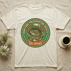 Cream t-shirt with a circular logo featuring a frog and "Rain Frog Preservation Society Est. Always."