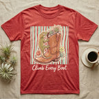 Red t-shirt with a cowboy boot, gecko, and flowers, text "Climb Every Boot".