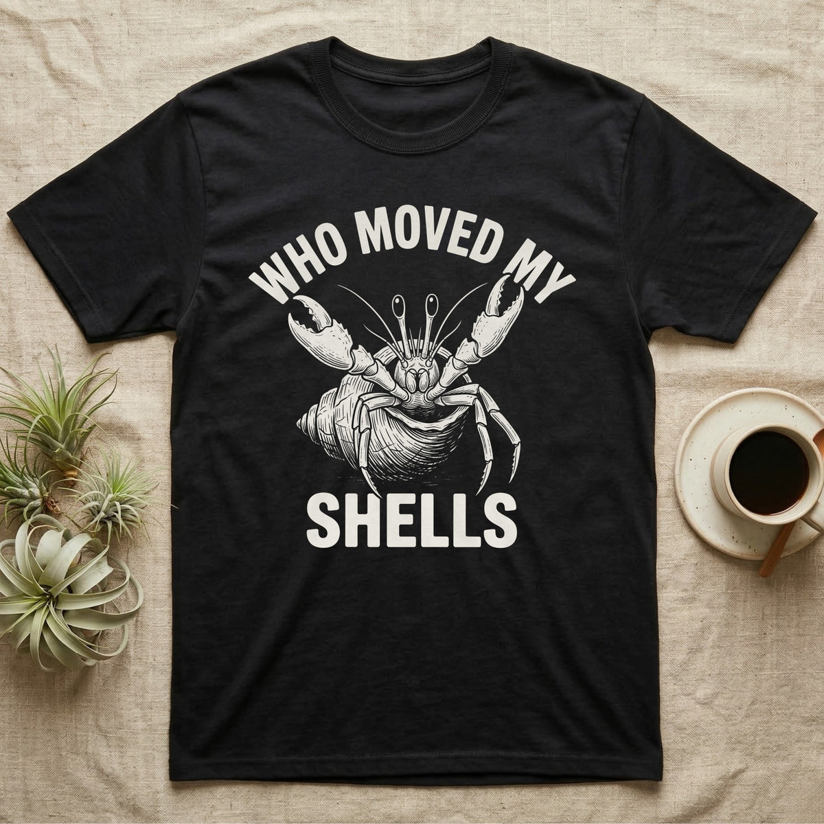 Hermit Crab Outrage T-Shirt in Black — White-line engraving of a hermit crab flinging both claws up under the words Who Moved My Shells