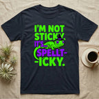 Crested Gecko Spellt-icky T-Shirt in Navy — Neon cartoon crested gecko in a witch hat with stacked text, "I'm Not Sticky, It's Spellt-icky."