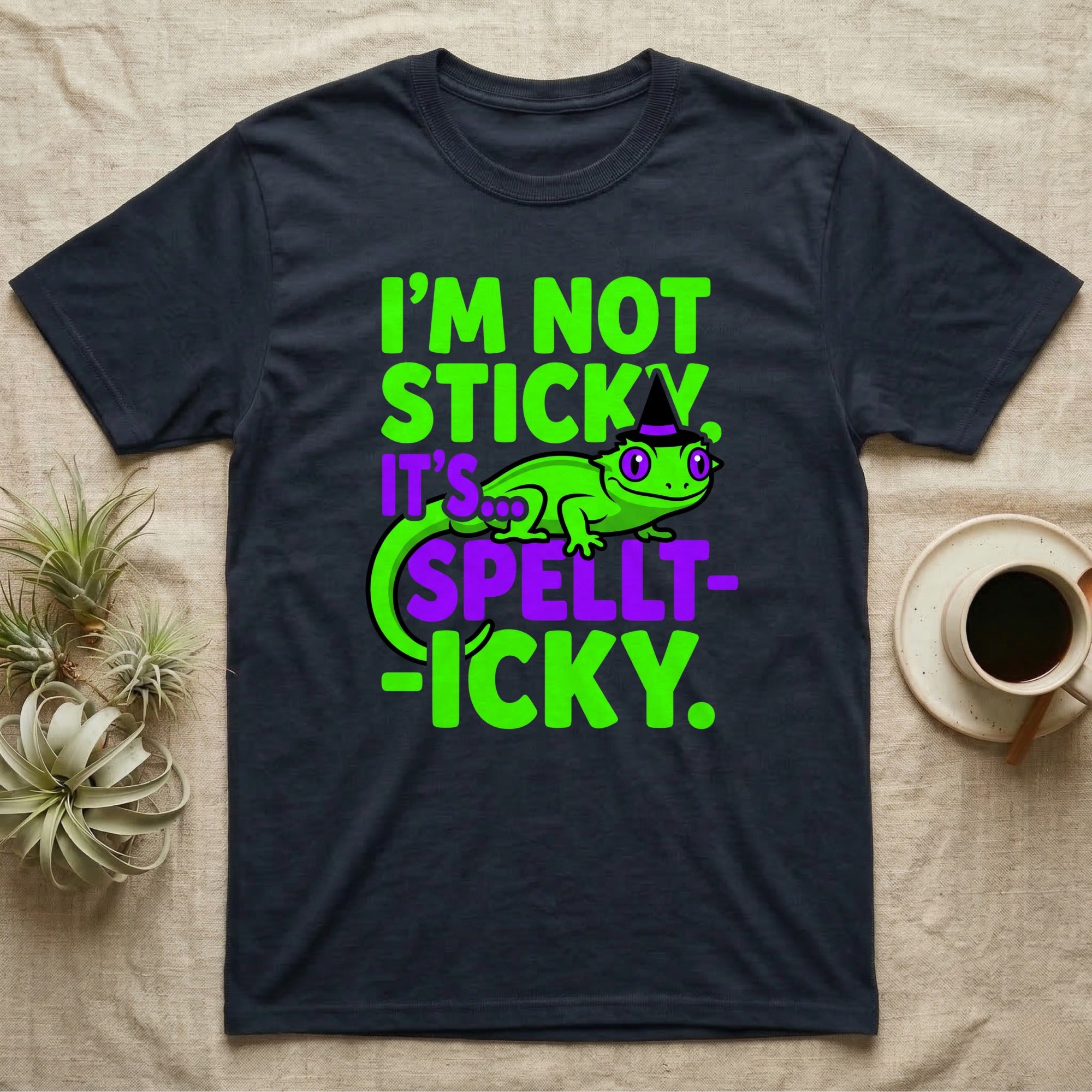 Crested Gecko Spellt-icky T-Shirt in Navy — Neon cartoon crested gecko in a witch hat with stacked text, "I'm Not Sticky, It's Spellt-icky."