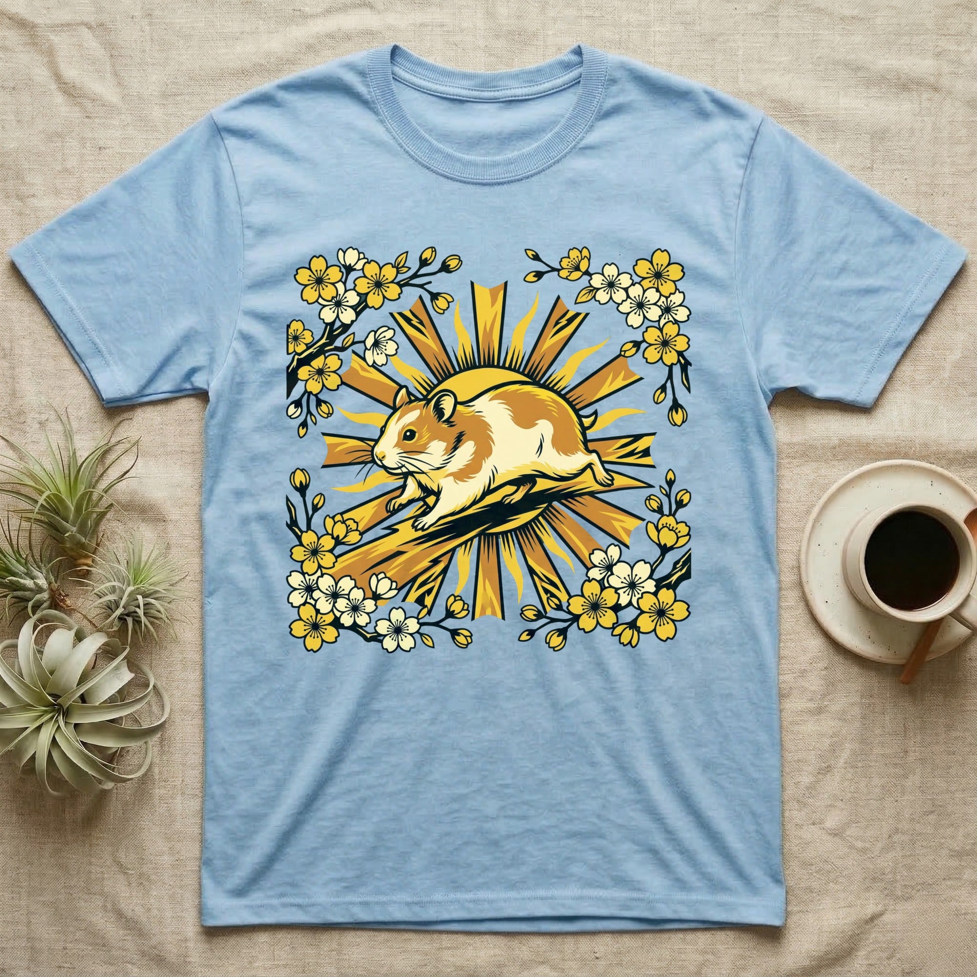 Light blue t-shirt featuring a hamster and floral sun design.