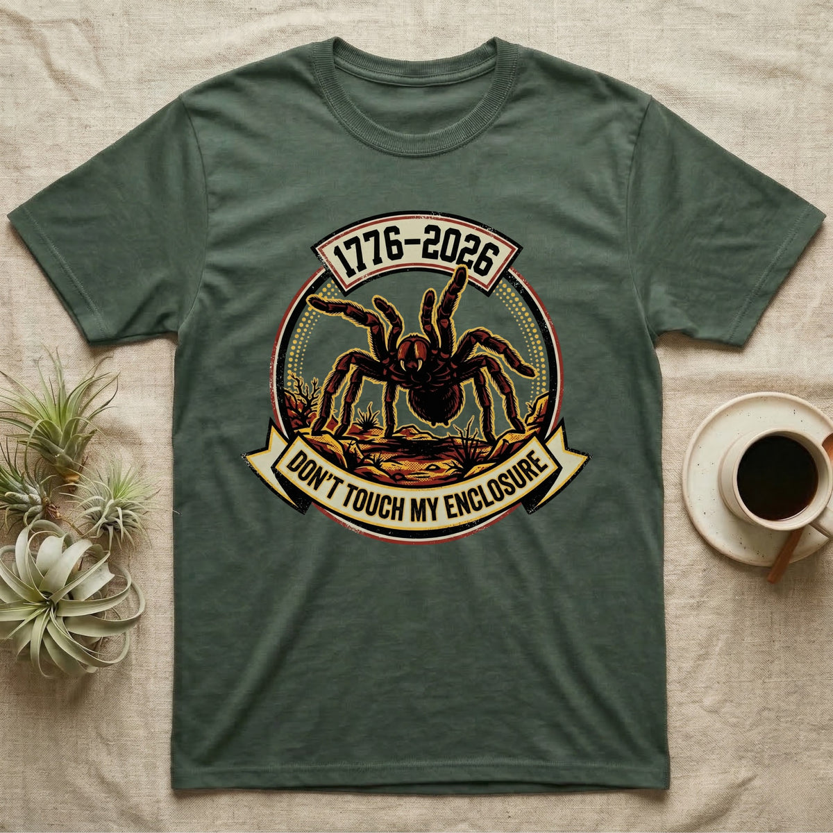 Tarantula Don't Touch Enclosure Tee in Military Green — Distressed circular badge of a defensive tarantula on desert ground, red and gold banner reading Don't Touch My Enclosure, on black.