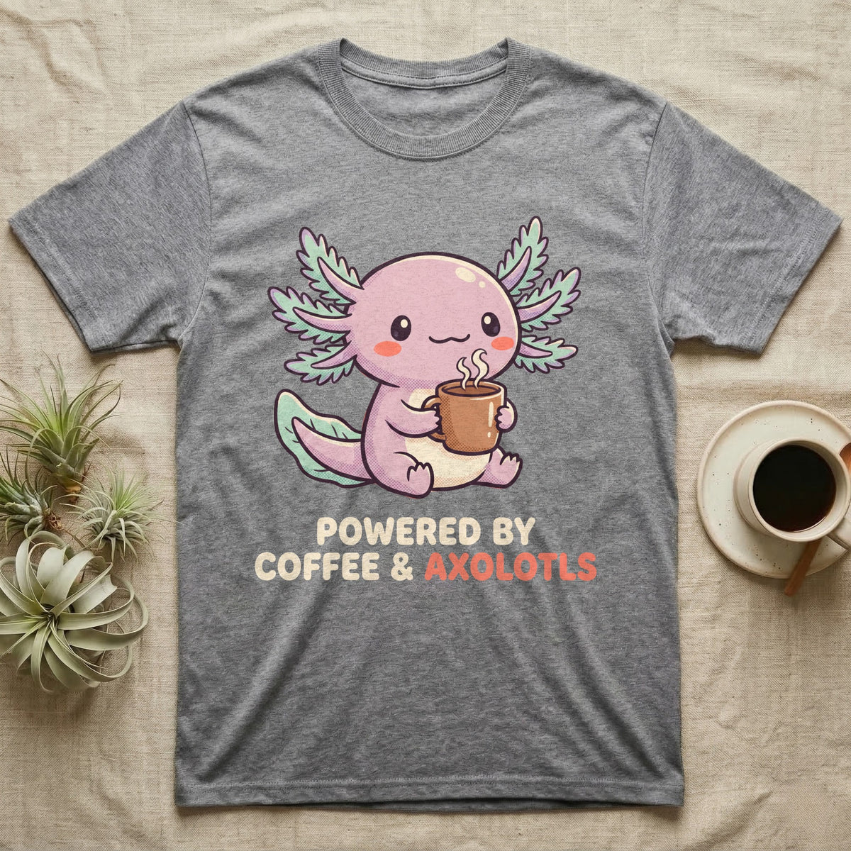Coffee And Axolotls T-Shirt in Sport Grey — Kawaii chibi illustration of an axolotl holding a coffee cup with soft text reading Powered By Coffee And Axolotls.