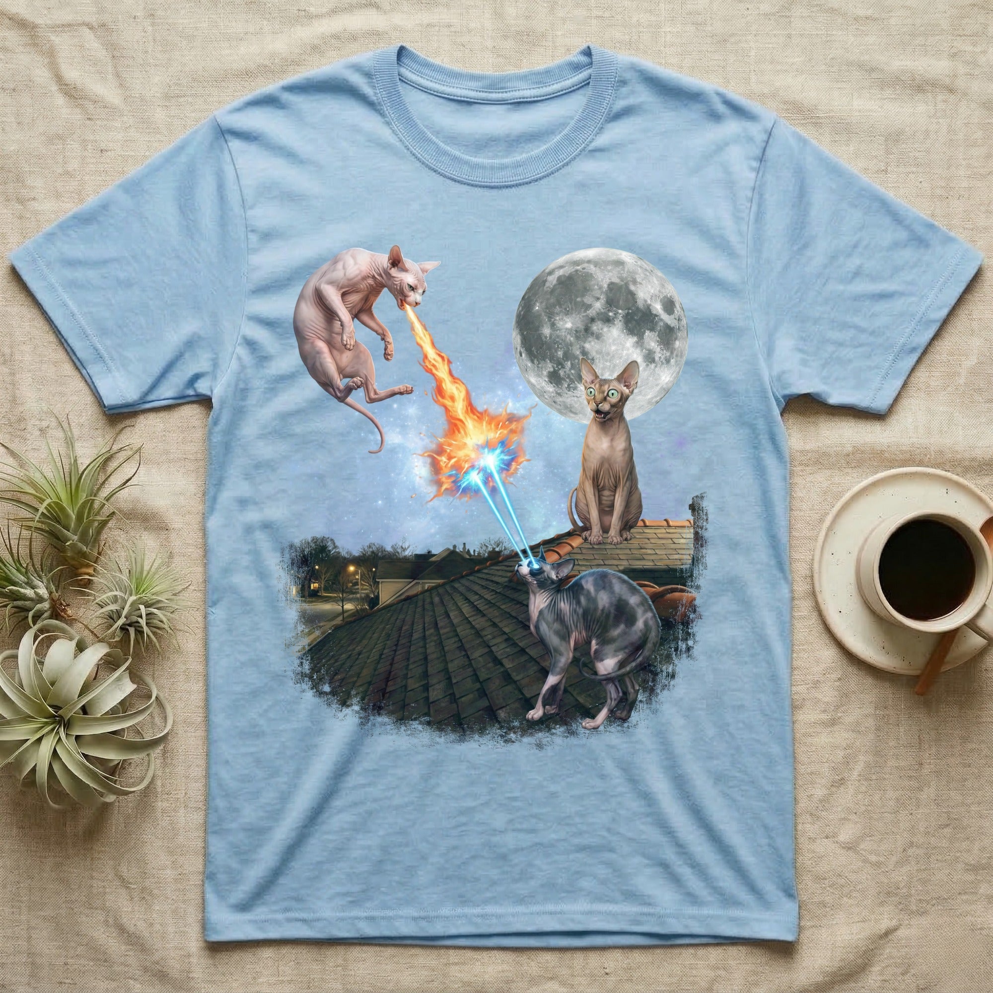 Sphynx cats shooting lasers at the moon on a light blue t-shirt.