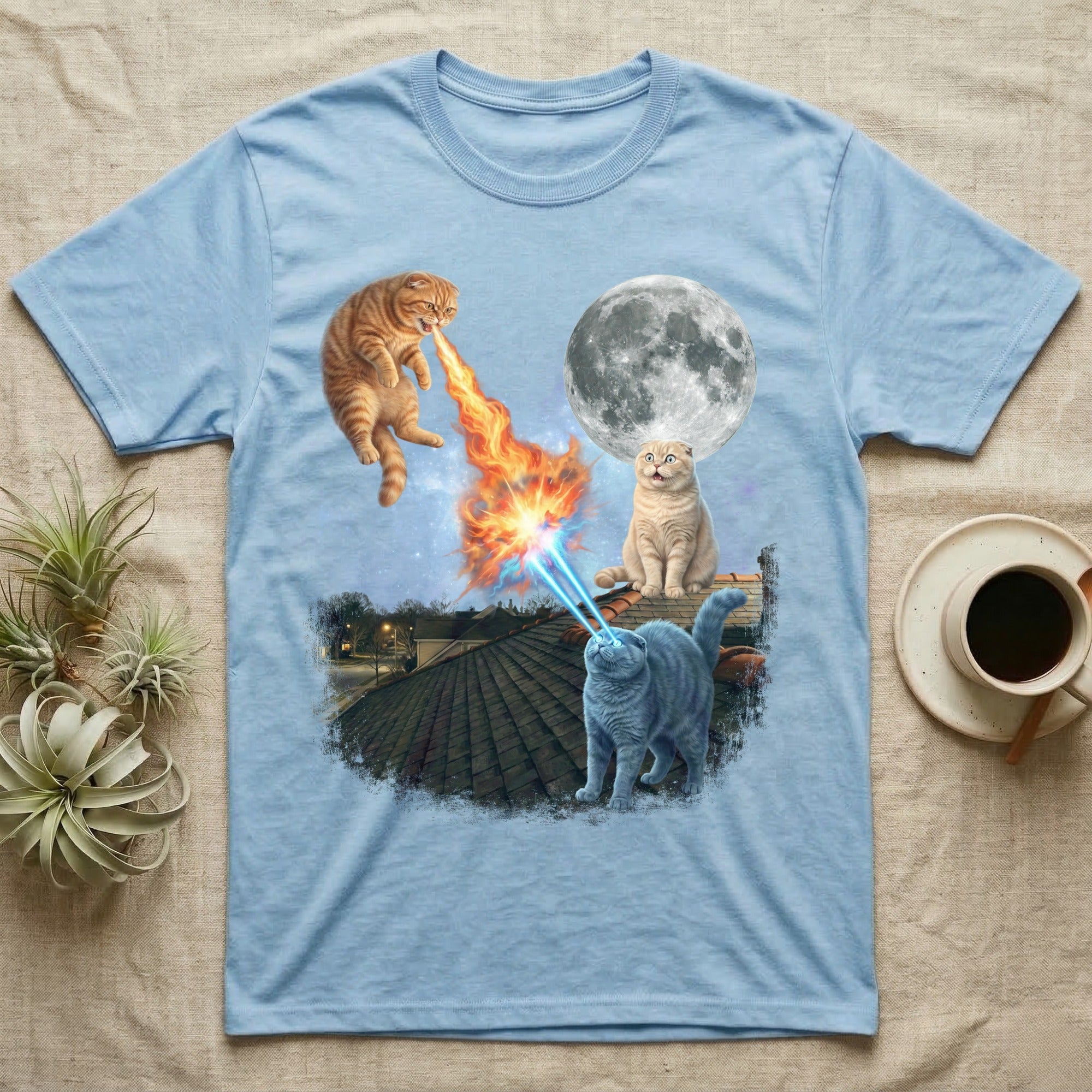 Light blue t-shirt with cats shooting lasers at the moon.