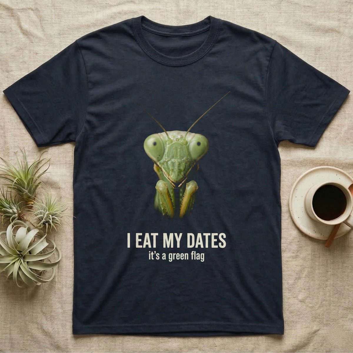 Deadpan macro mugshot of a green praying mantis on black, captioned I eat my dates, it's a green flag. — shown on a Navy tee.